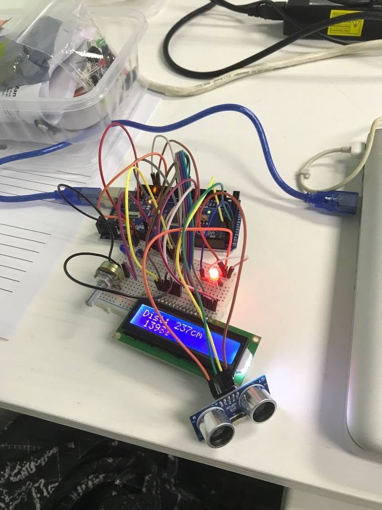 Arduino ultrasonic distance sensor rig displaying a 237 cm reading on an LCD