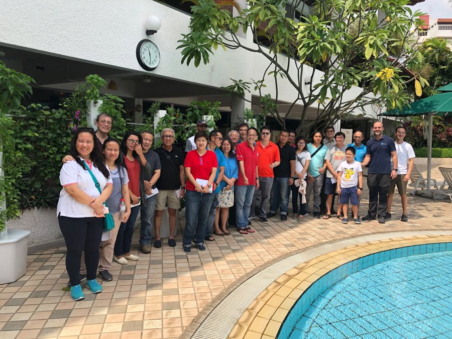 The 10 November 2018 class posing together outdoors beside vertical hydroponic tower gardens